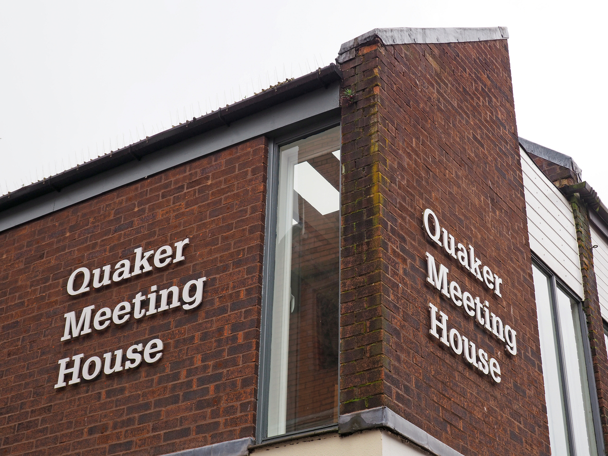 Quakers respond to police raid with worship meeting outside Scotland Yard