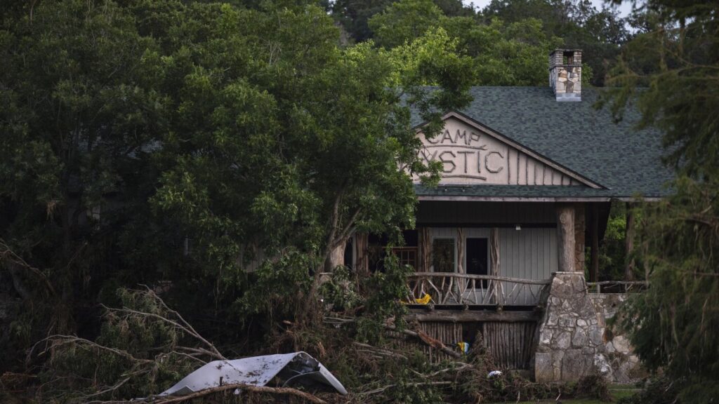 FEMA removed dozens of Camp Mystic buildings from 100-year flood map before expansion, records show : NPR
