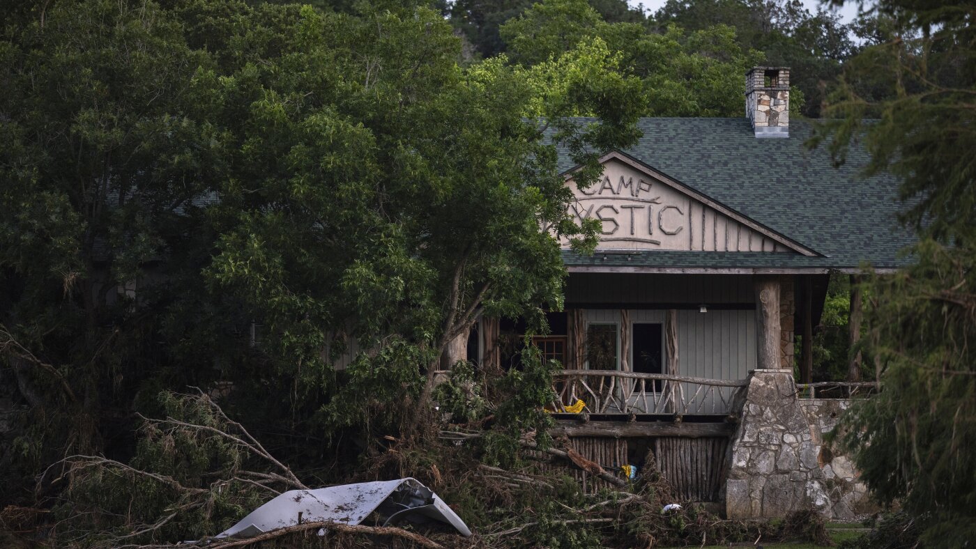 FEMA removed dozens of Camp Mystic buildings from 100-year flood map before expansion, records show : NPR
