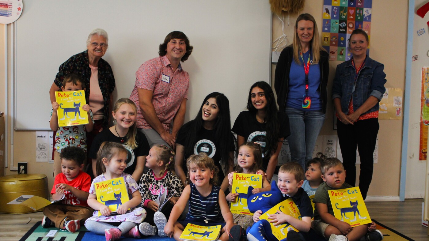 Volunteers foster literacy by reading, giving books to kids : NPR