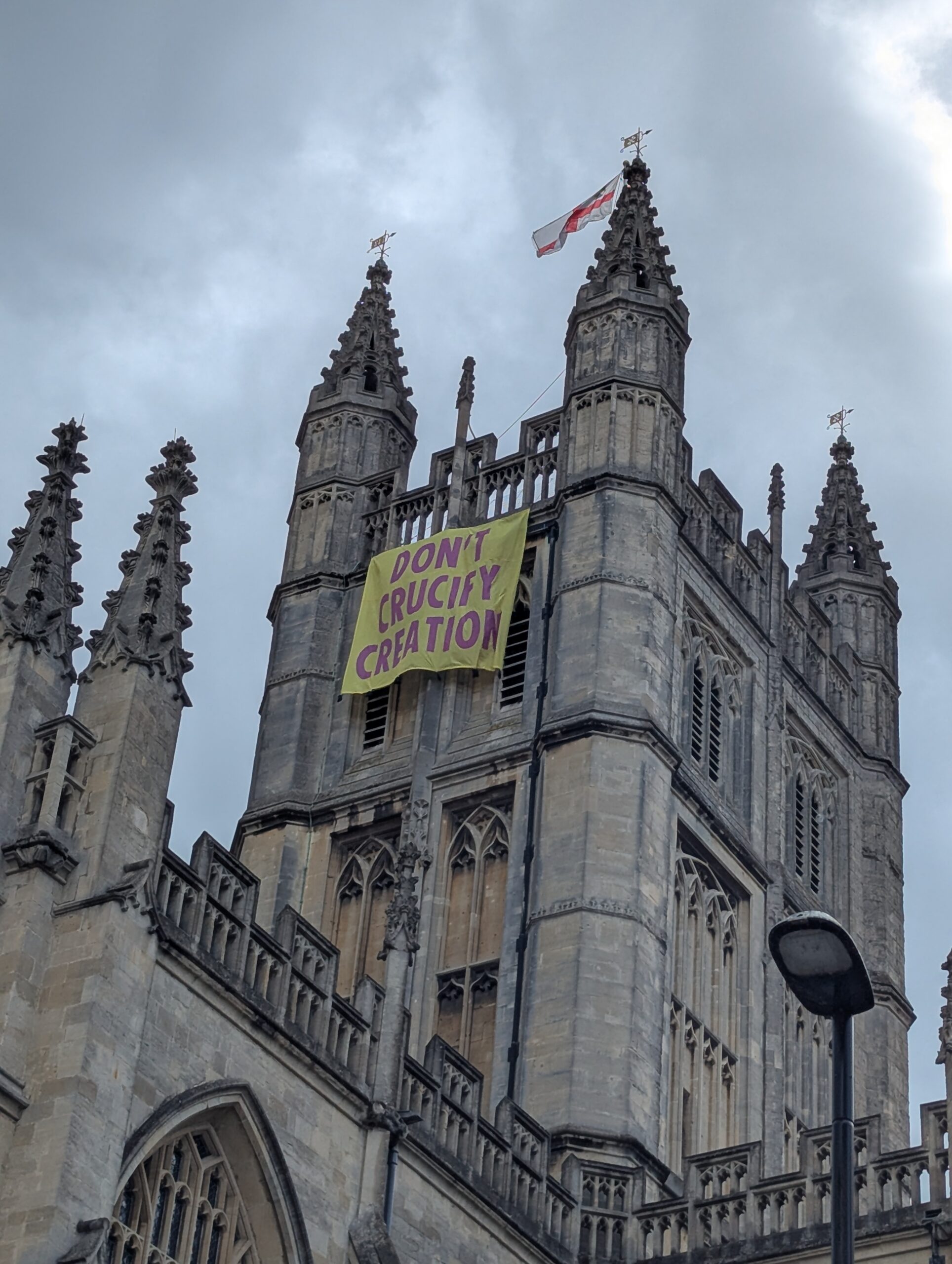 Christian climate protesters charged over banner drop from Bath Abbey