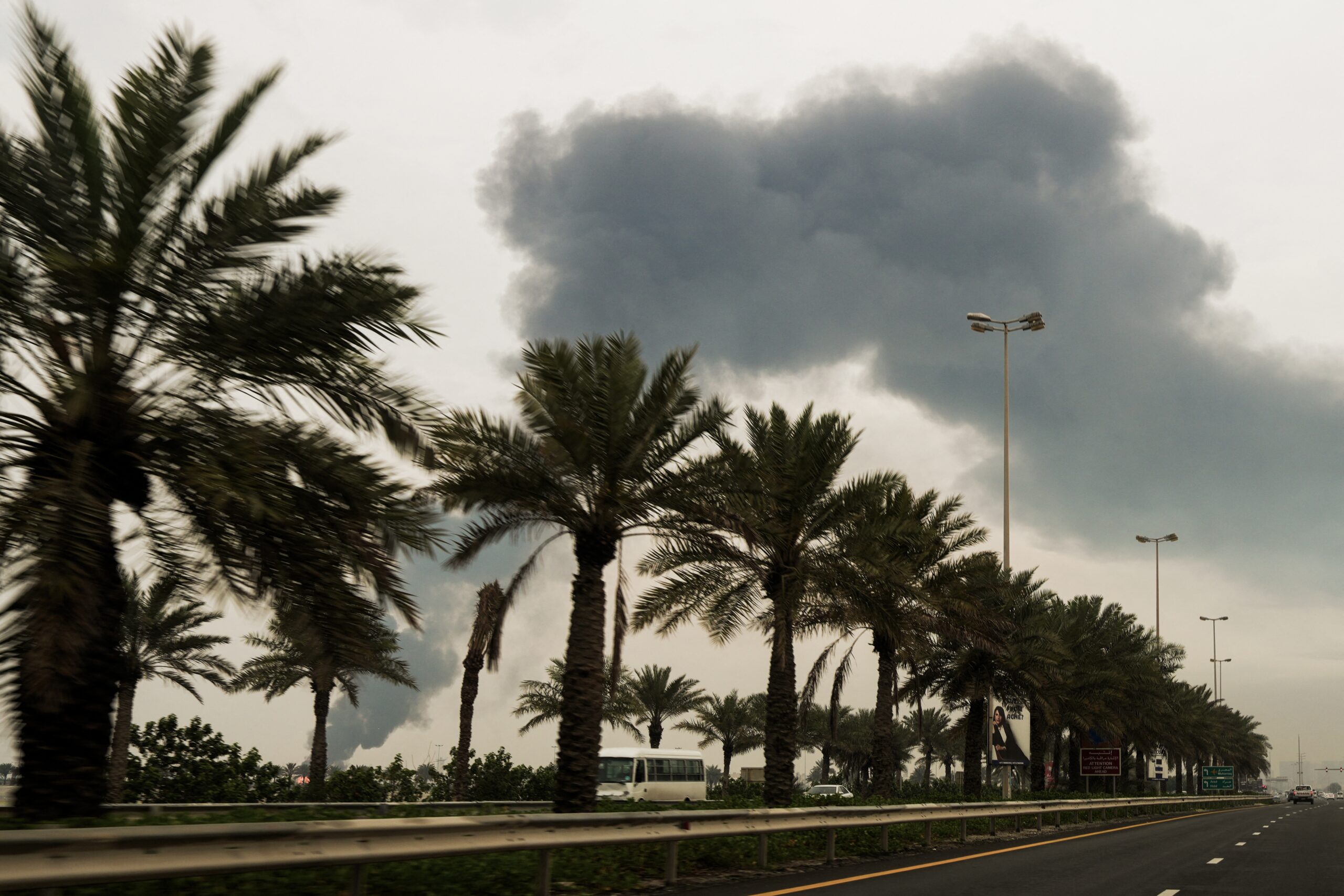 Evacuated Sailors Await Decisions on Their Future After Middle East The Moral Compass News A plume of smoke rises after a reported Iranian strike on fuel tanks in Muharraq, Bahrain, on March 12.